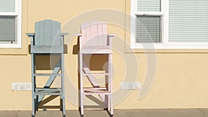 Lifeguard chairs in California USA. Life guard high seat by ocean sea beach. Los Angeles summertime.