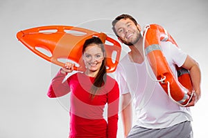 Lifeguard couple with rescue equipment