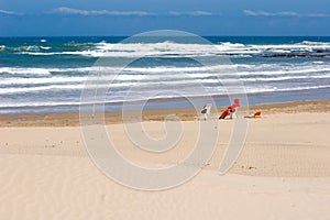 Lifeguard on empty beach