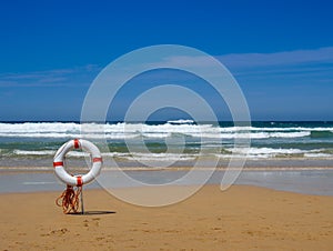 Lifeguard equipment in sand on a beach