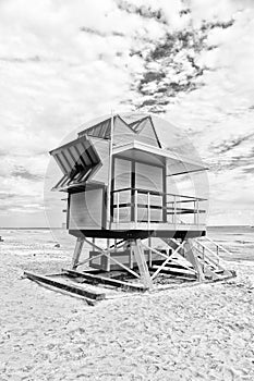 Lifeguard house on sand beach in miami, usa. Tower for rescue baywatch in typical art deco style. Wooden house on ocean