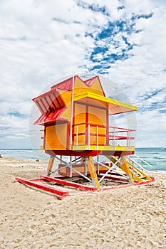 Lifeguard house on sand beach in miami, usa. Tower for rescue baywatch in typical art deco style. Wooden house on ocean shore on c