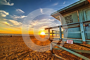 Lifeguard hut in Malibu at sunset photo