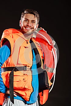 Lifeguard in life vest with ring buoy lifebuoy.