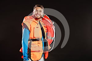 Lifeguard in life vest with ring buoy lifebuoy.