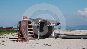 Lifeguard post and fishing boat