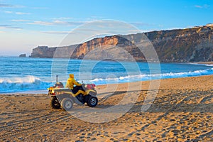 Lifeguard riding buggy beach Portugal