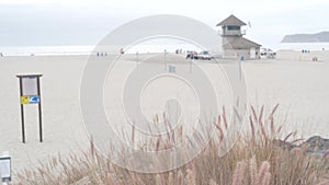 Lifeguard stand or life guard tower hut, coast surfing on California beach, USA.