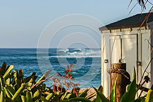 Lifeguard storage shed and high waves on Sunset Beach, Oahu, Hawaii