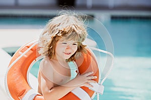 Lifeguard. Summer holidays. Happy child playing with lifebuoy. Summer child. Life save.