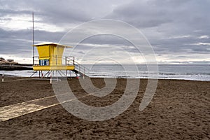 Lifeguard tower on a beach on the island of Gran Canaria. Cloudy sky