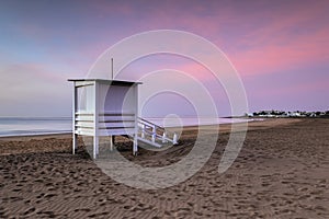 Lifeguard tower on the beach at sunrise in Puerto del Carmen