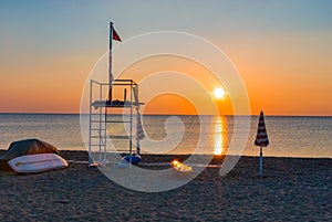 Lifeguard tower beach sunset sunrise parasol boat