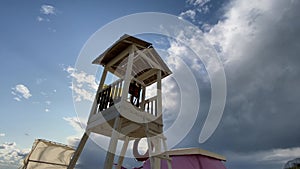 Lifeguard tower on the beach at sunset time