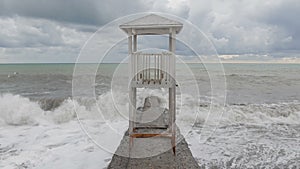 Lifeguard tower at empty waterfront beach in the off-season.