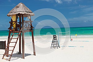 Lifeguard tower near a beach voley field