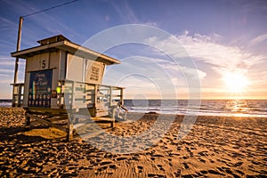 Lifeguard tower on one of the sandy Malibu beaches; beautiful sunset light; Pacific Ocean coastline, California