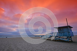 Lifeguard tower at sunset at Hermosa Beach, California photo