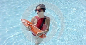 Lifeguard walking through shallow water