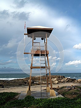 lifeguard warning tower on the beach and blue sky with cloudy over the sea