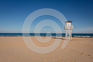 Lifeguard watch tower on empty beach
