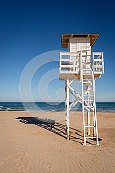 Lifeguard watch tower on empty beach