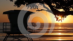 Lifeguard watch tower sunny sunset beach. Watchtower hut, pacific ocean coast. California summertime