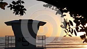 Lifeguard watch tower sunny sunset beach. Watchtower hut, pacific ocean coast. California summertime