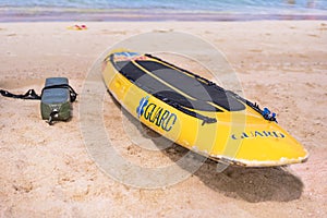 Lifeguard yellow board and buoy on the sandy beach Naminoue in Naha City in Okinawa Prefecture, Japan