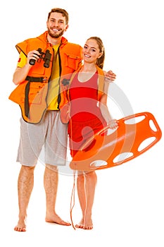 Lifeguards in life vest with rescue buoy.