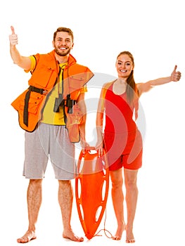 Lifeguards in life vest with rescue buoy. Success.