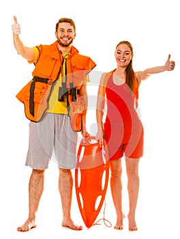 Lifeguards in life vest with rescue buoy. Success.