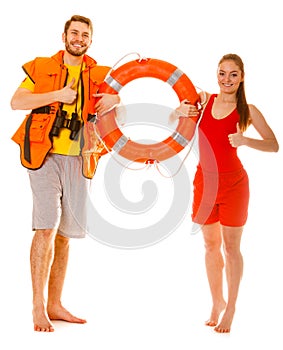 Lifeguards in life vest with ring buoy. Success.