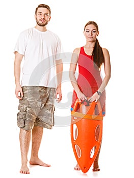 Lifeguards with rescue buoy. Accident prevention.