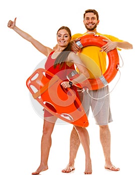 Lifeguards with rescue and ring buoy lifebuoy.