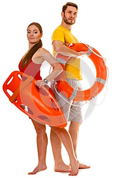 Lifeguards with rescue and ring buoy lifebuoy.