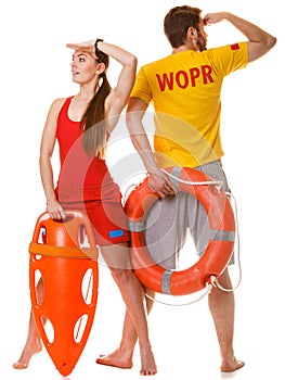 Lifeguards with rescue and ring buoy lifebuoy.