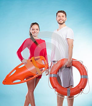 Lifeguards with rescue and ring buoy lifebuoy.