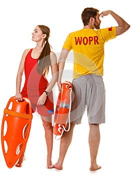 Lifeguards with rescue and ring buoy lifebuoy.