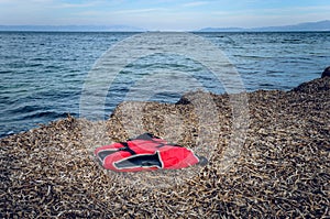 Lifejackets left by refugees on the shore of Lesvos photo