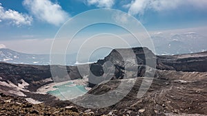 A lifeless acid lake on top of an active volcano.