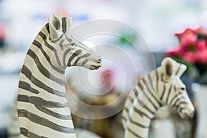 Lifelike plastic zebra sculpture toy set on display