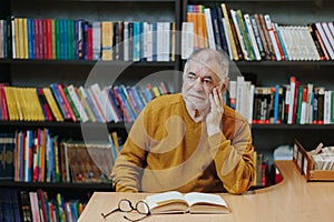 Lifelong Learning Front View of Senior Man Immersed in Reading