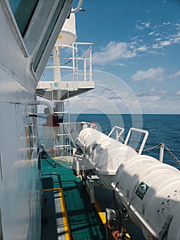 Liferafts on the deck of ocean offshore vessel. LSA life saving equipment. photo