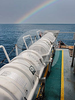 Liferafts on the deck of ocean offshore vessel. LSA life saving equipment. photo