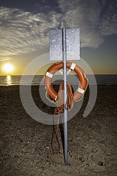 Lifesaver buoyancy aid at sunrise