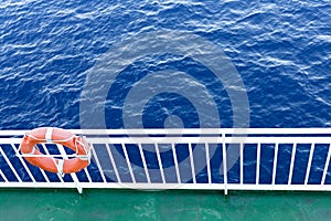 Lifesaver hanging in the guardrail of a ship