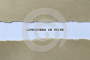 lifesavers in white on white paper