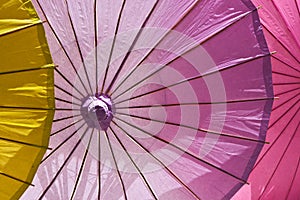 Lifesize colorful cocktail umbrellas, illuminated. photo