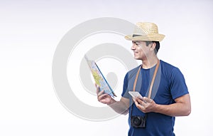 Lifestyle adventure leisure travel concept. Confident handsome traveler young man wear blue casual and hat with camera holding map